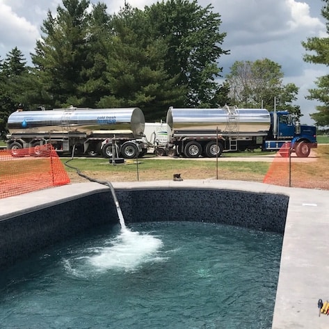 Bright Water Services tanker filling a pool