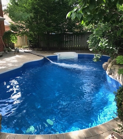 Pool filling in progress with delivered water